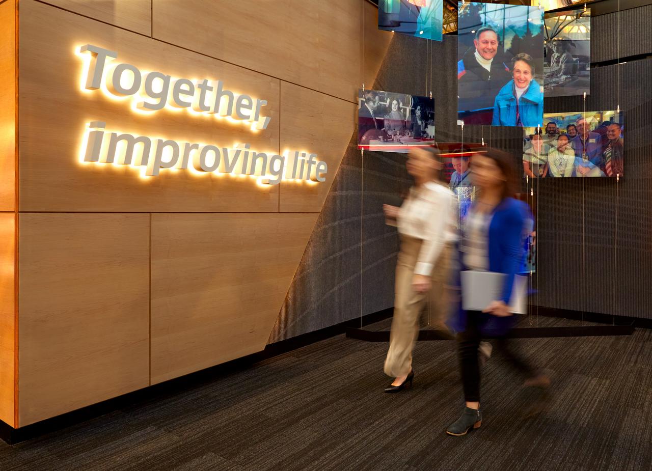 image of blurred associates walking through capabilities center