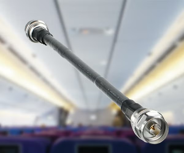 image of cable based antenna product with interior of commercial airplane in the background