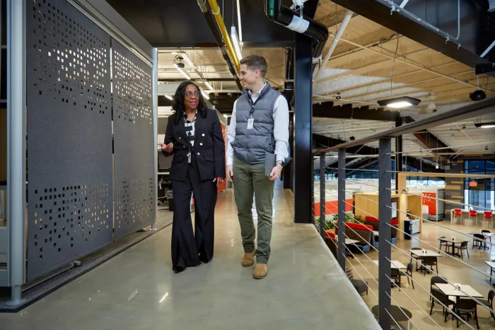 associates walking through hallway in plant