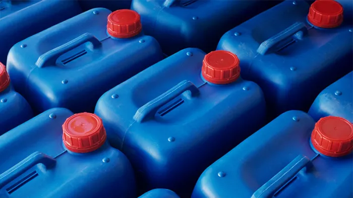 Plastic jerry cans in Plastics factory, close-up, elevated view.