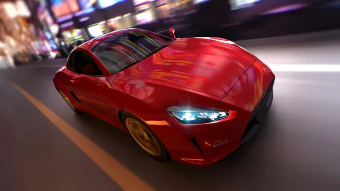 Red car speeding through an urban city with motion blur.