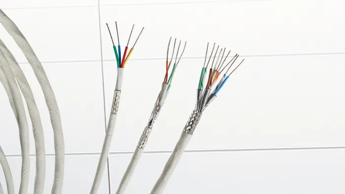Three ethernet cables on tile floor.